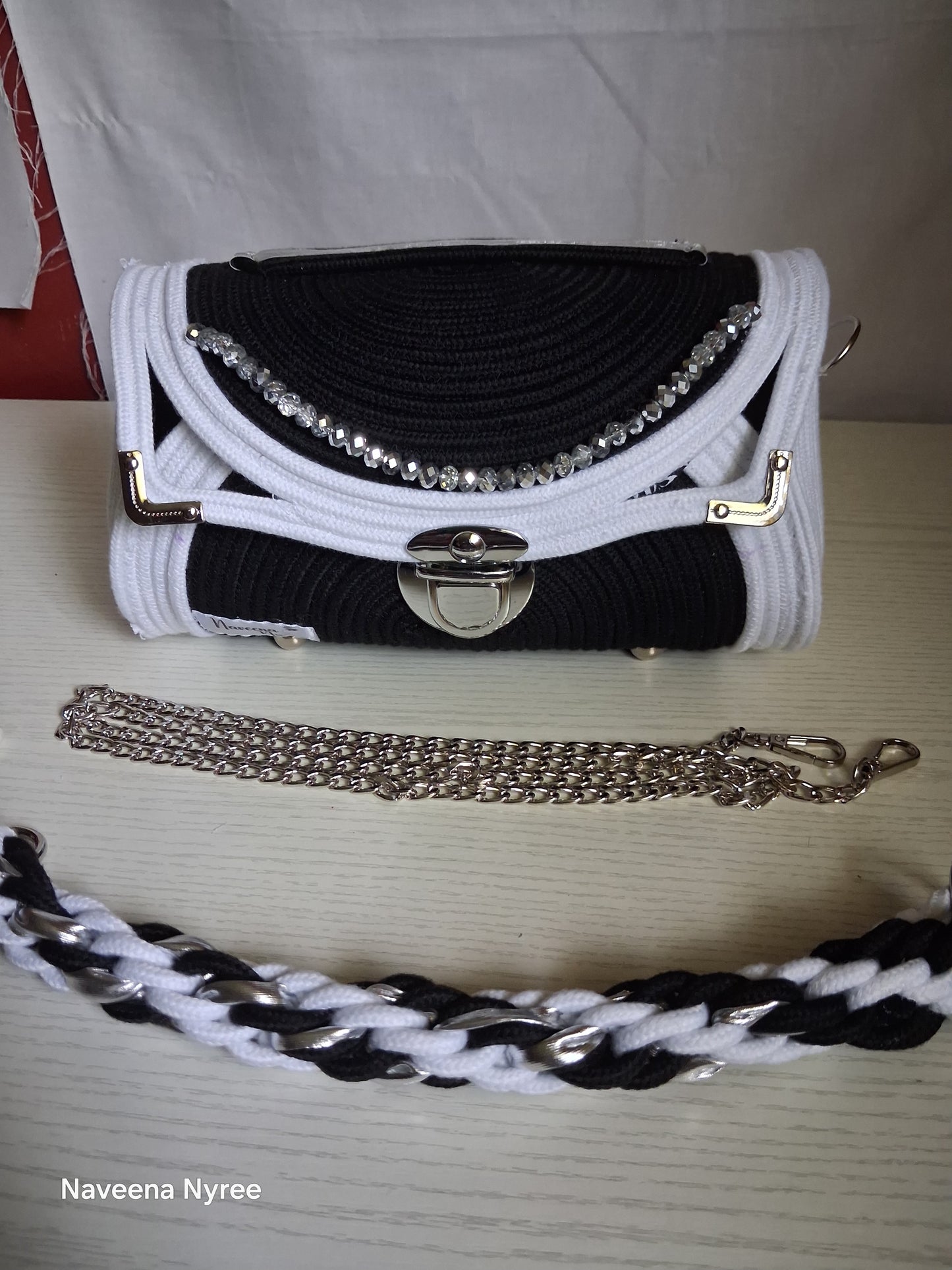 Black, white, and silver rope purse