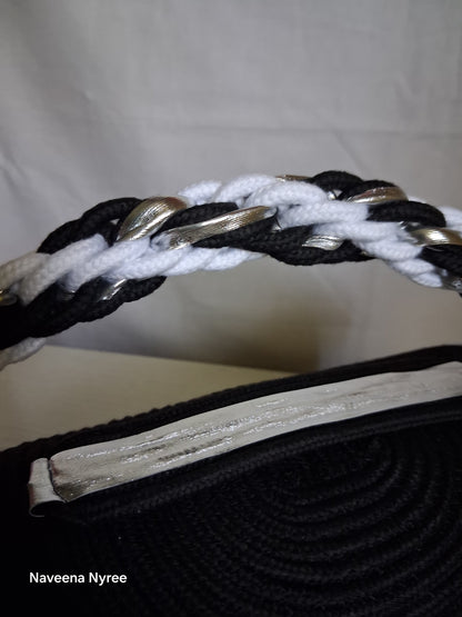Black, white, and silver rope purse