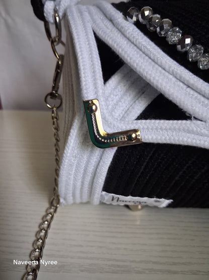 Black, white, and silver rope purse