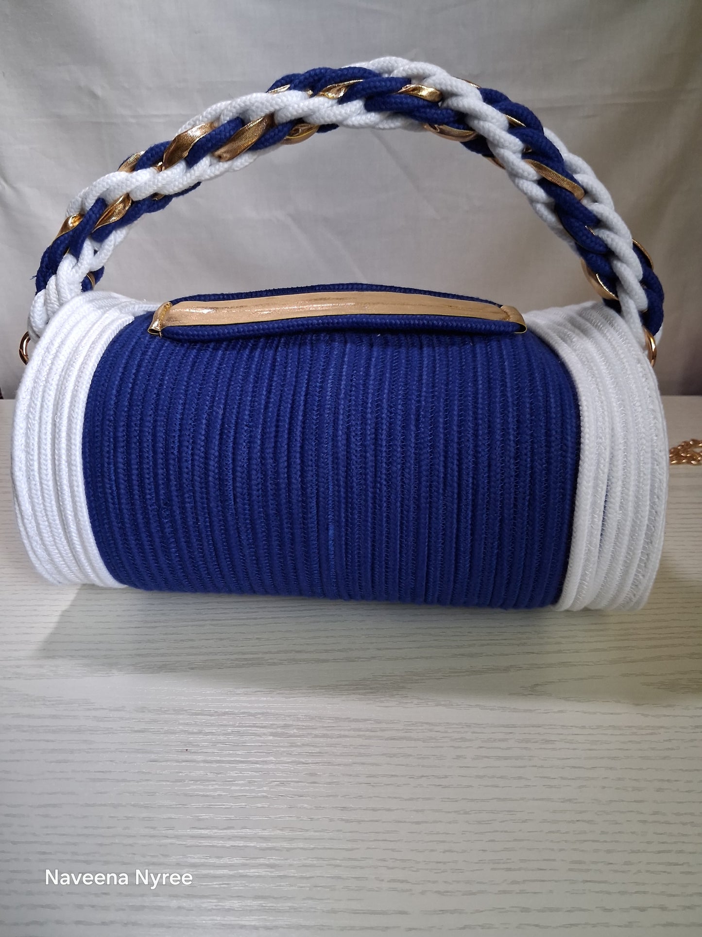 Royal blue and white rope/cord purse.