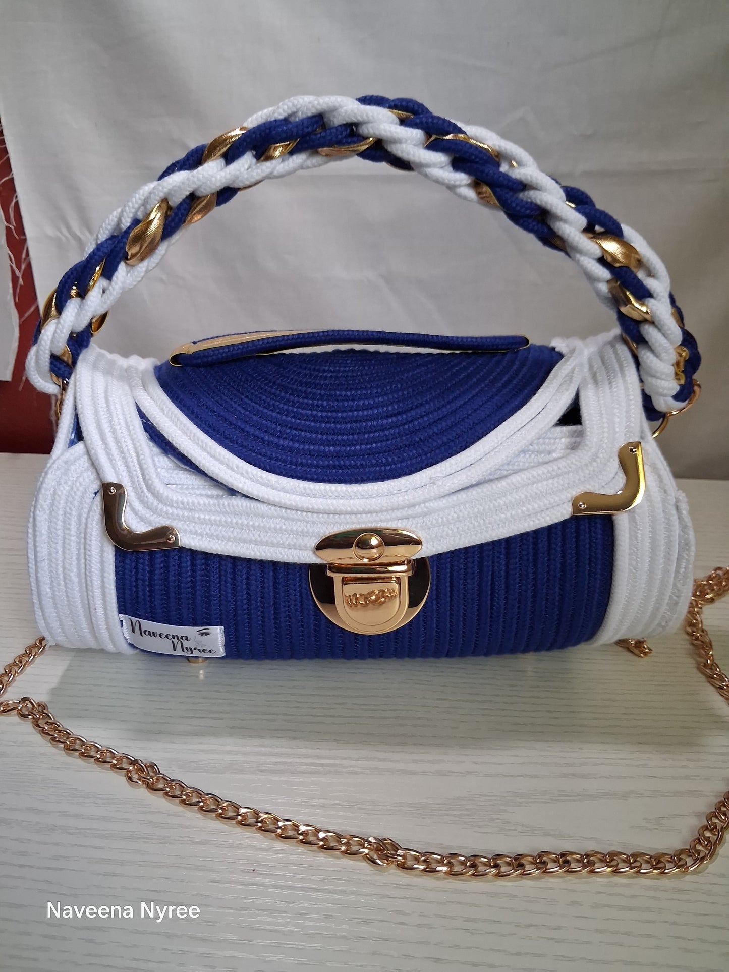 Royal blue and white rope/cord purse.