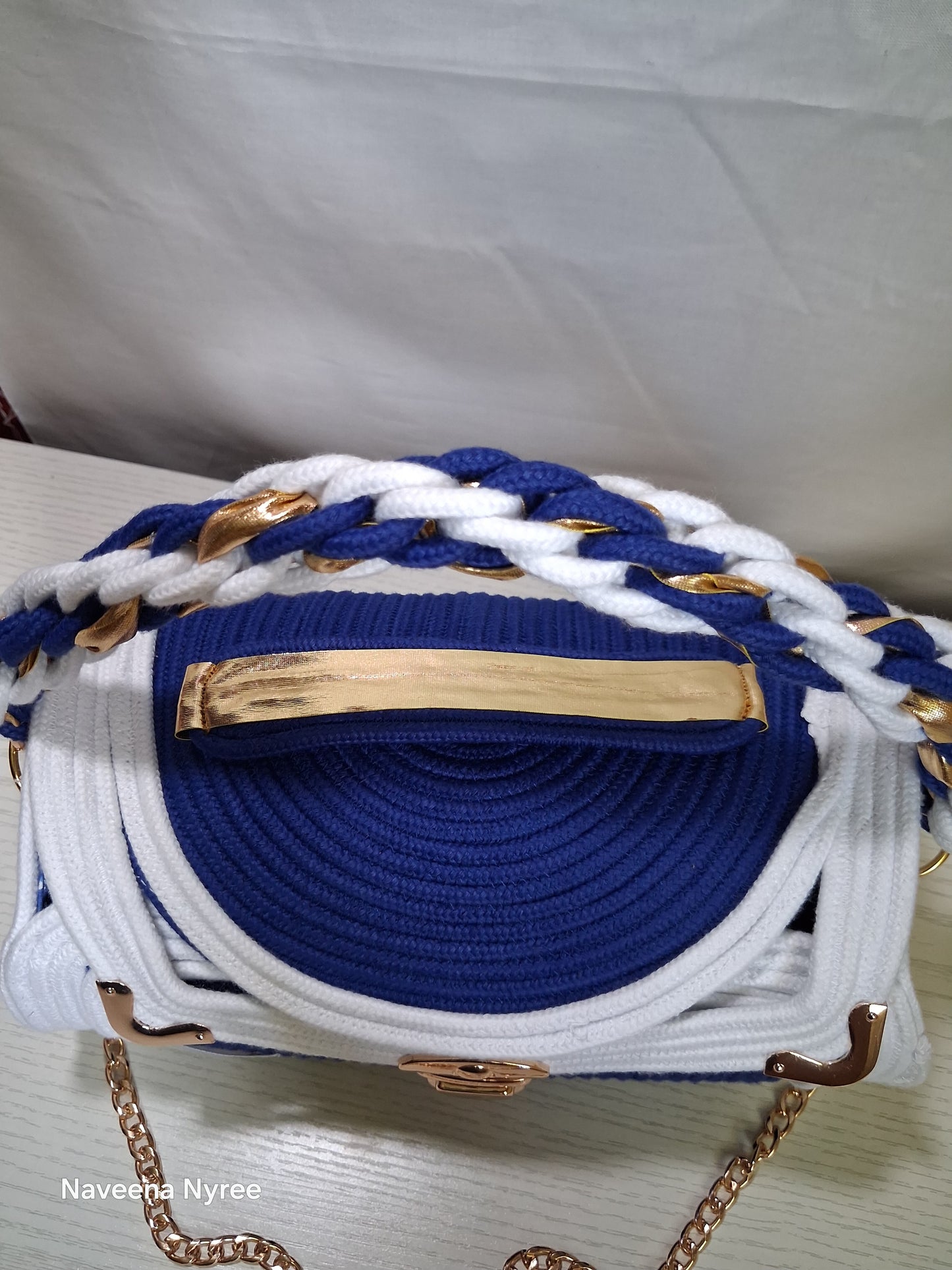 Royal blue and white rope/cord purse.