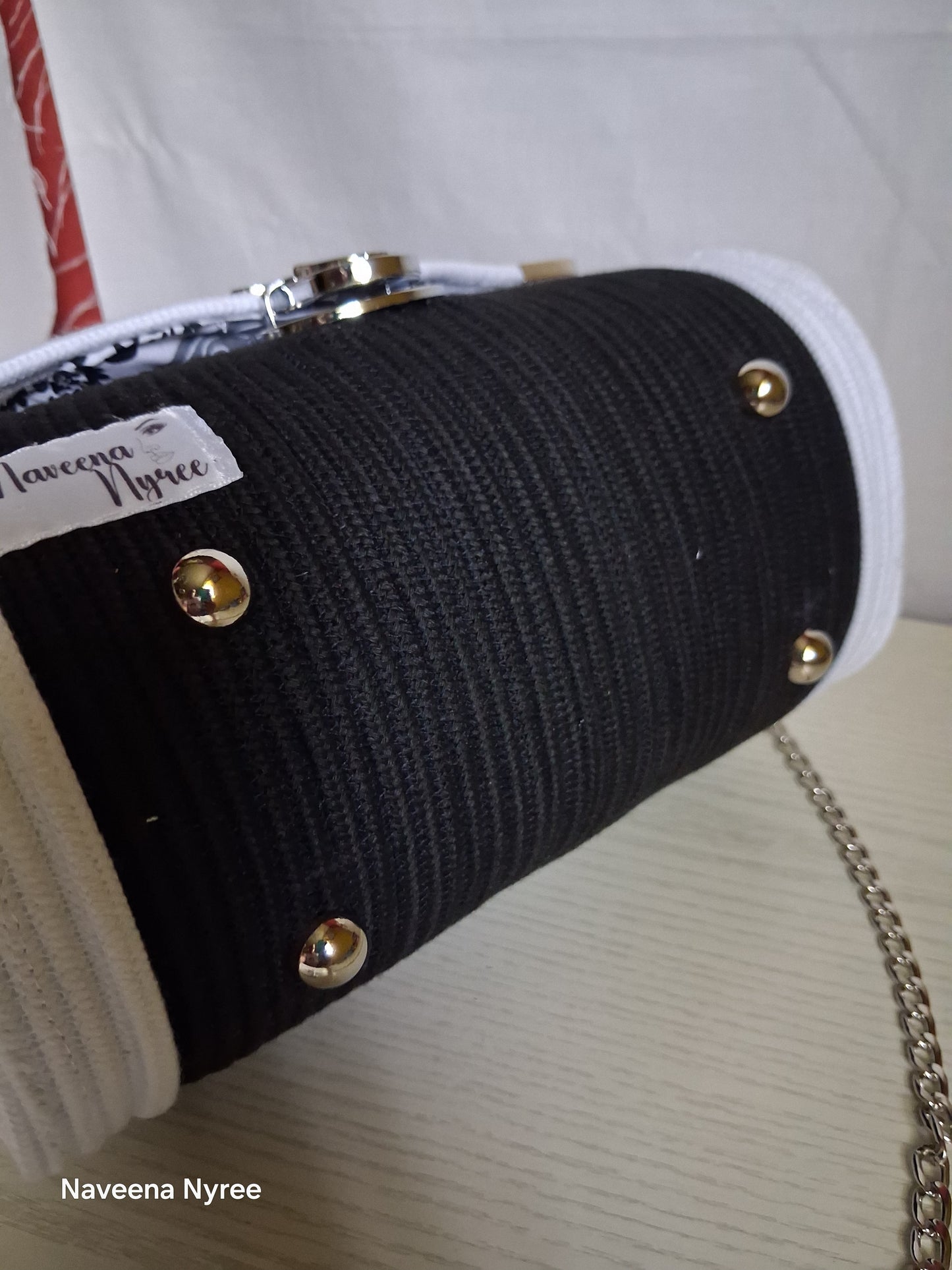 Black, white, and silver rope purse