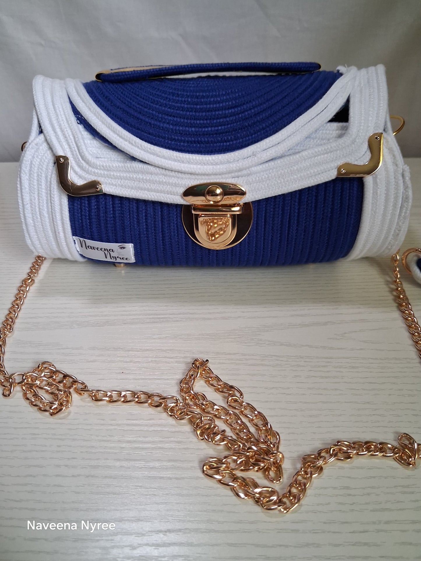 Royal blue and white rope/cord purse.