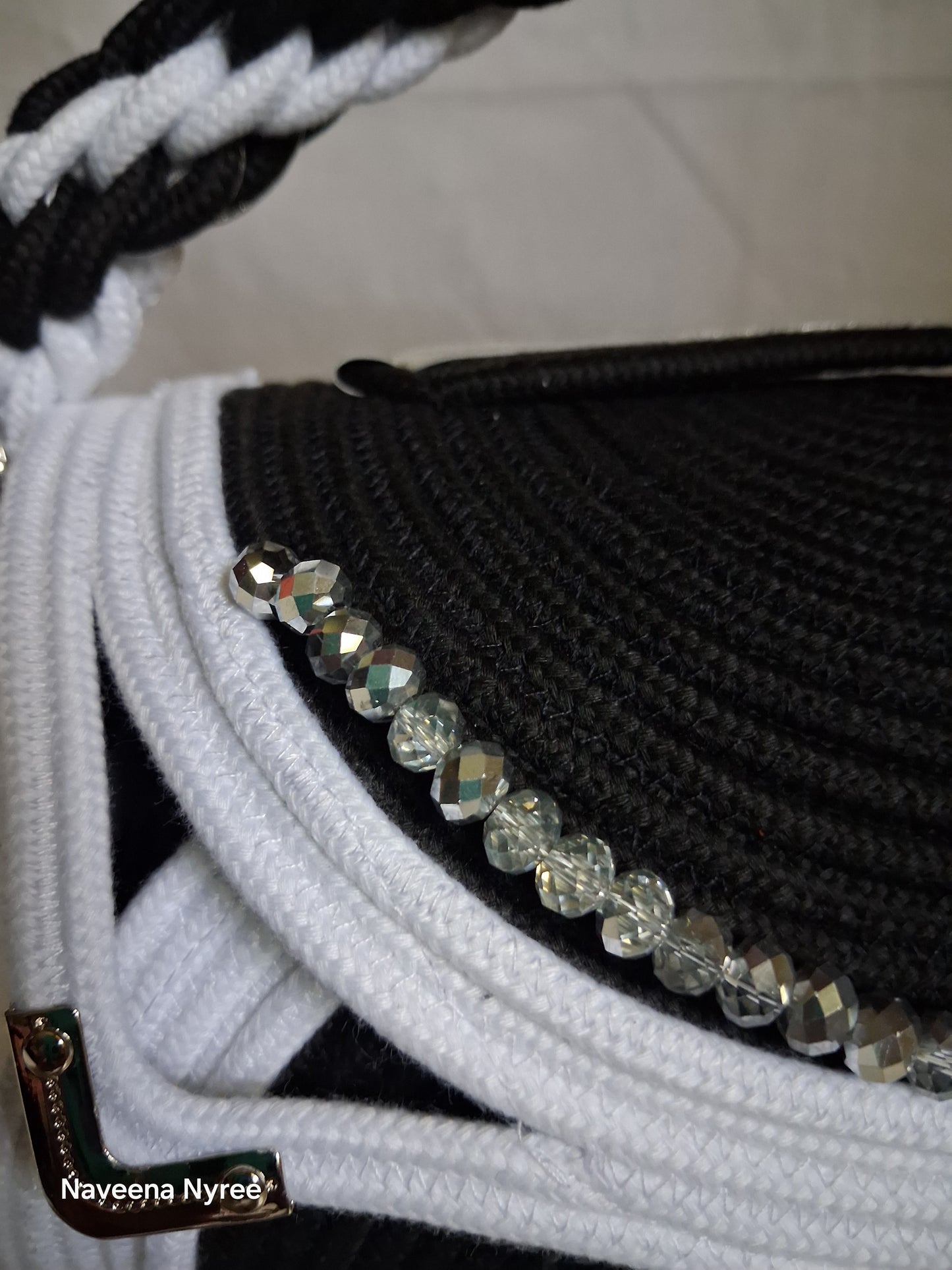 Black, white, and silver rope purse