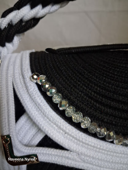Black, white, and silver rope purse