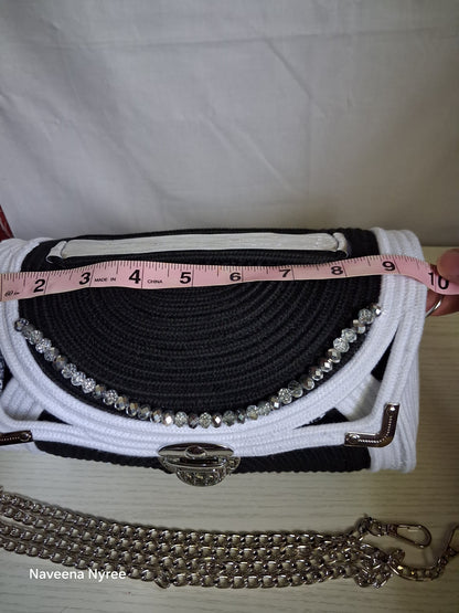 Black, white, and silver rope purse