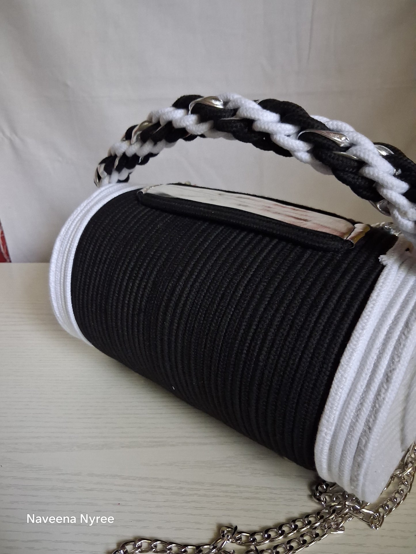 Black, white, and silver rope purse