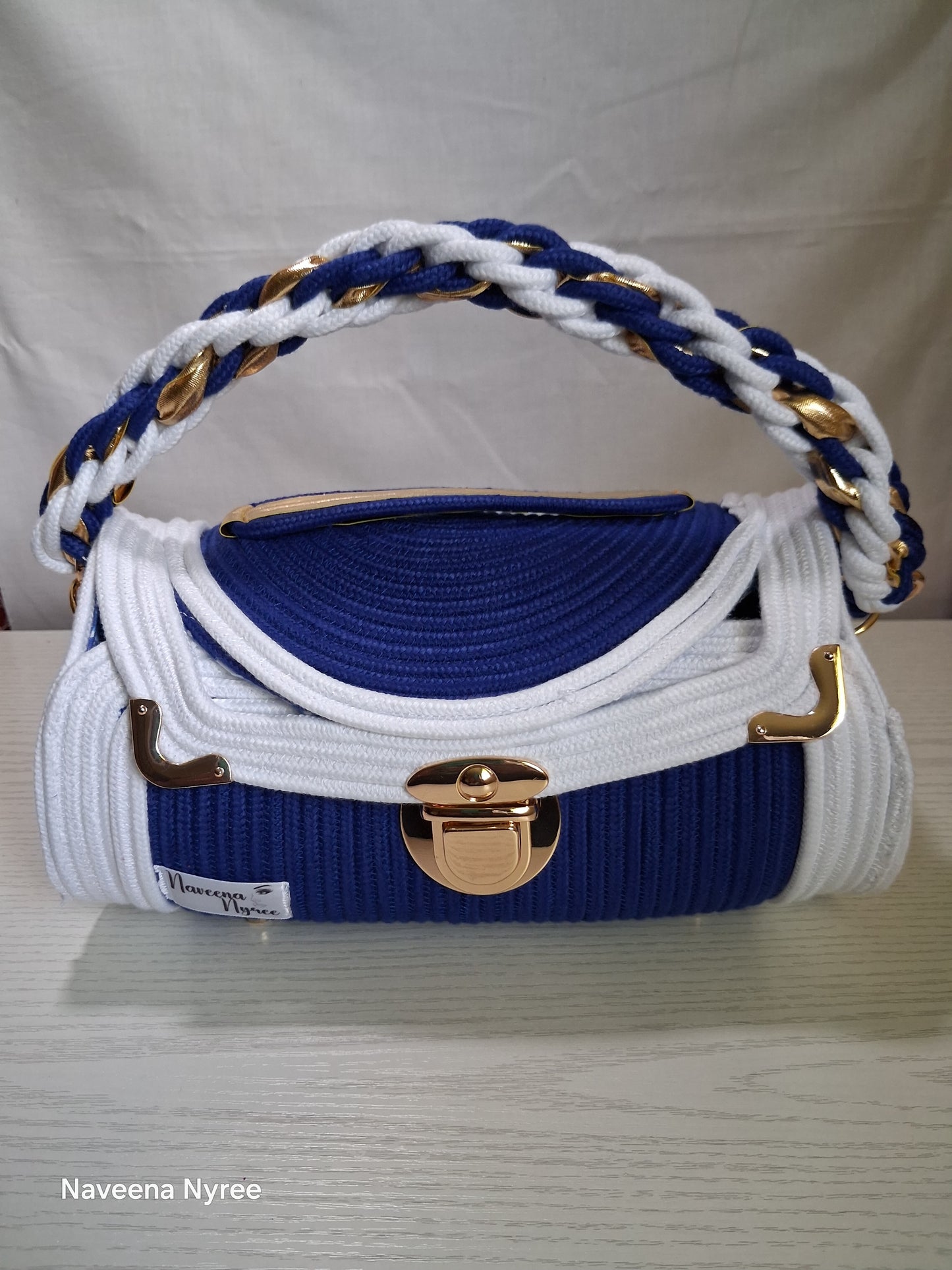 Royal blue and white rope/cord purse.