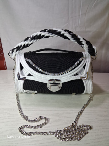 Black, white, and silver rope purse