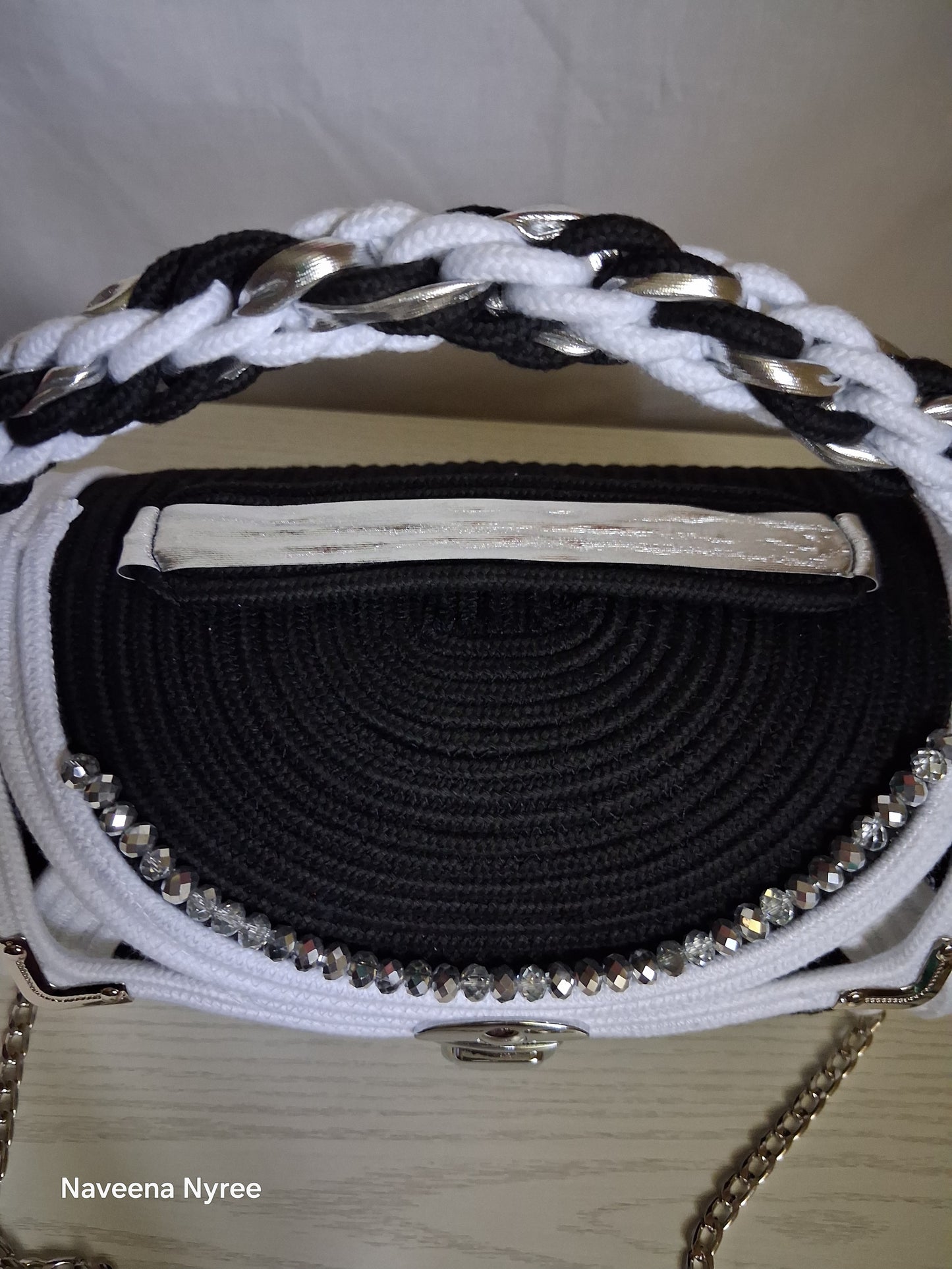 Black, white, and silver rope purse